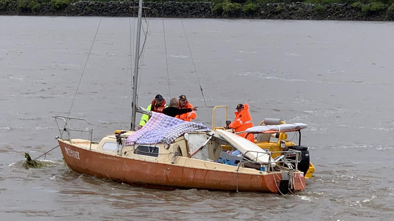 An SES flood boat crew helps out Anthony Ward on the Pioneer River on January 16, 2023. Picture: Duncan Evans