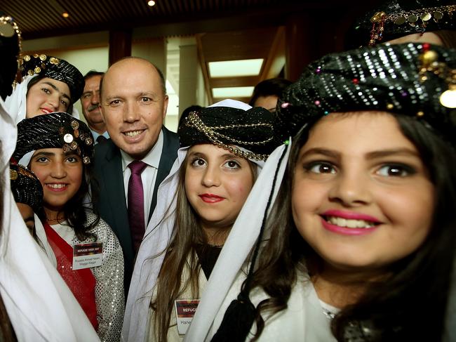 Minister for Immigration and Border Protection Peter Dutton with Yazidi refugees at a Refugee Week 2017 event at Parliament House in Canberra. Picture Kym Smith