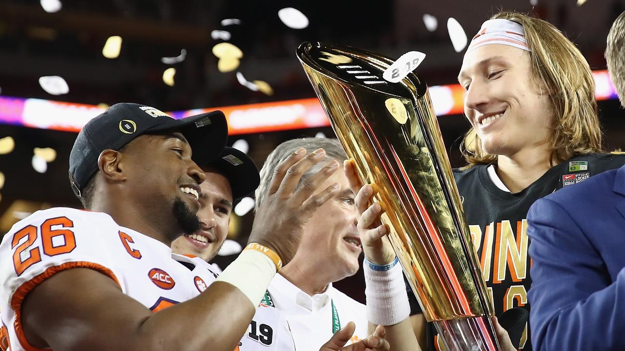 Clemson Tigers celebrate with the CFP National Championship trophy.