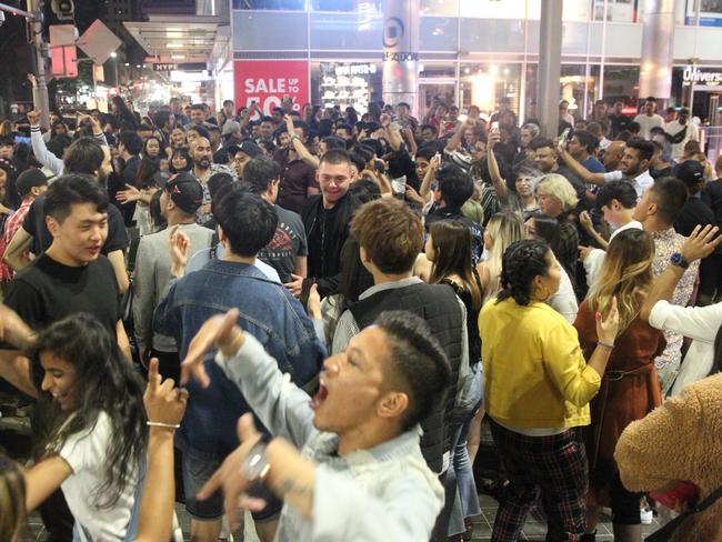 Partygoers enjoyed some music pumping on George St, Sydney during New Year’s Eve celebrations. Picture: Bill Hearne