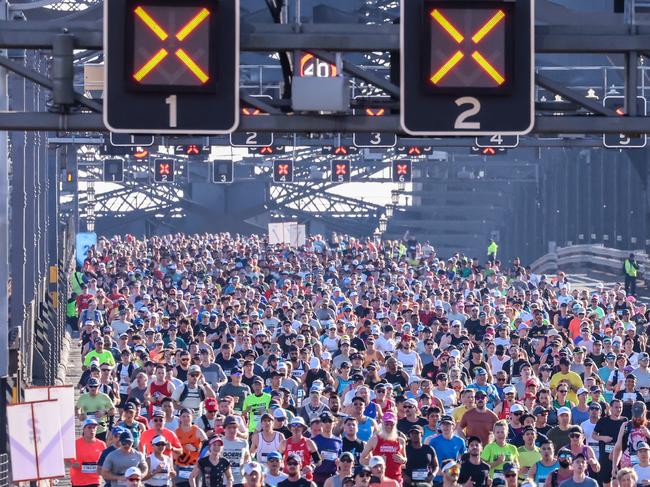 Competitors run across the Sydney Harbour Bridge during the 2023 Sydney Marathon. This year’s women’s title was won by the USA’s Betsy Saina with a time of 2:26:47, and the men’s champion was Morocco’s Othmane El Goumri with a winning time of 2:08:20. Picture: Jenny Evans/Getty Images 