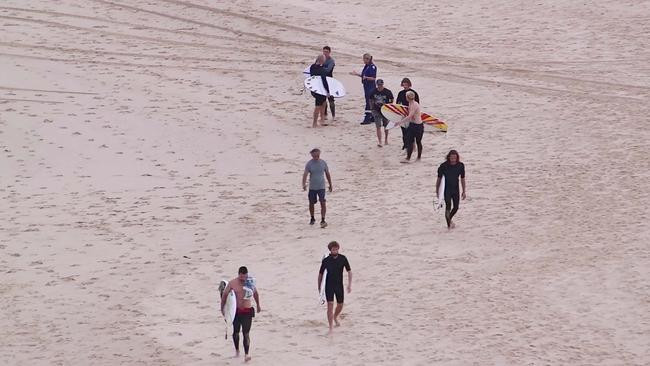 Shattered bystanders on the beach. Picture: Frank Redward