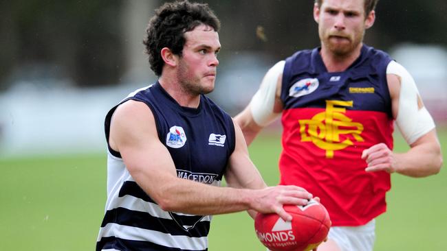 S47sr934 Riddell District Football League seniors match between Macedon and Diggers Rest at Tony Clarke Reserve, Macedon. Macedn's James Wright,1 with ball.