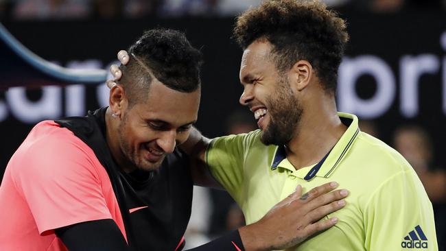 Nick Kyrgios shares a moment with Jo-Wilfried Tsonga after his big win. Picture: AP Photo