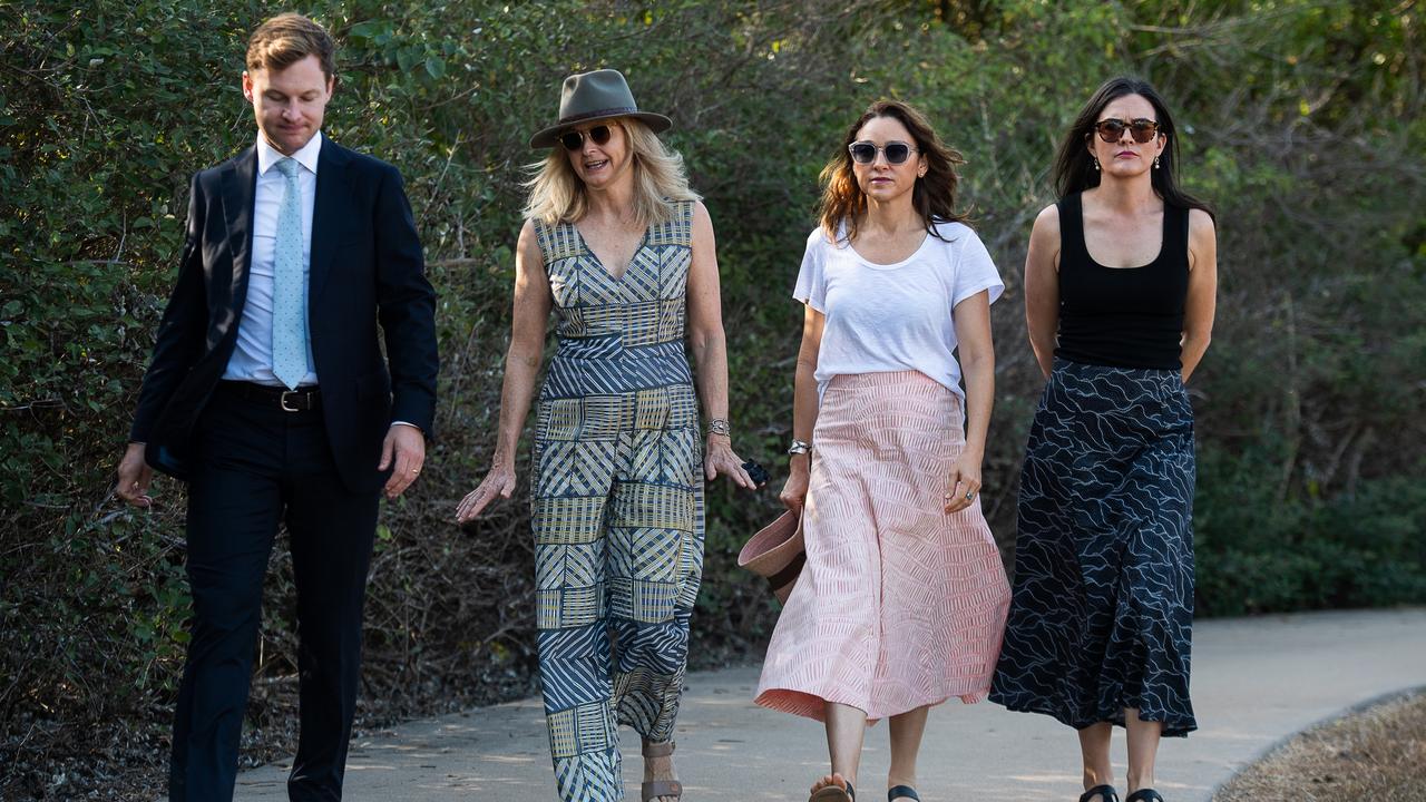 The family of Ngeygo Ragurrk's lawyer James Lowrey, left, with coroner Elisabeth Armitage, counsel assisting Peggy Dwyer and Maria Walz take part in a ceremony at Mindil Beach, where on December 23 2019 the 40-year-old woman was killed by her partner Garsek Nawirridj. Picture: Pema Tamang Pakhrin