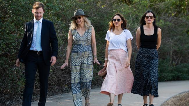 The family of Ngeygo Ragurrk's lawyer James Lowrey, left, with coroner Elisabeth Armitage, counsel assisting Peggy Dwyer and Maria Walz take part in a ceremony at Mindil Beach, where on December 23 2019 the 40-year-old woman was killed by her partner Garsek Nawirridj. Picture: Pema Tamang Pakhrin