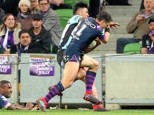 Billy Slater does a shoulder charge on Sosaia Feki of the Sharks to stop him from scoring a try  during the NRL Preliminary Final match between the Melbourne Storm and the Cronulla Sharks.  (Photo by Scott Barbour/Getty Images). Picture: Scott Barbour