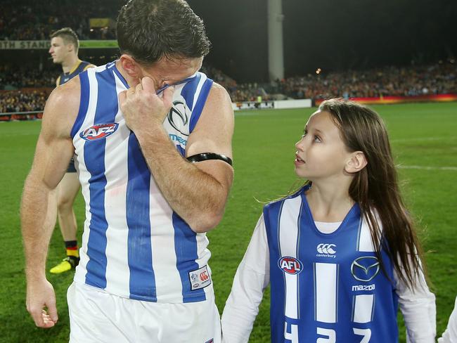 Brent Harvey wipes the tears away as he walks off for the last time. Picture: Michael Klein