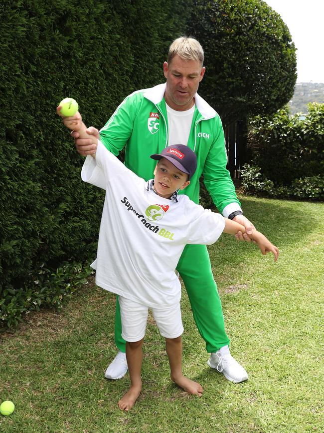 Shane Warne with KFC SuperCoach BBL fan Harry Piper (7). Picture: Brett Costello