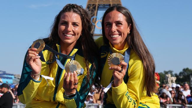 Jess and Noemie with their gold medals at the Eiffel Tower. Picture: Jack Guez/AFP