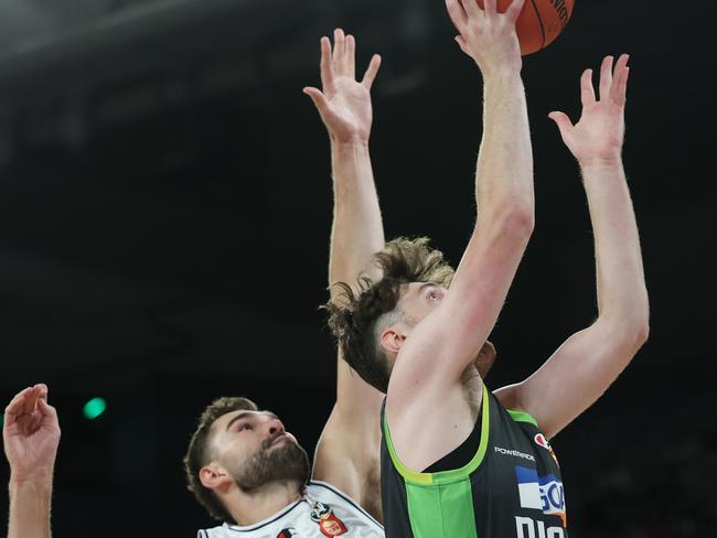 MELBOURNE, AUSTRALIA - FEBRUARY 16: Matt Hurt of the Phoenix drives to the basket under pressure during the NBL Play-In match between South East Melbourne Phoenix and Adelaide 36ers at John Cain Arena, on February 16, 2025, in Melbourne, Australia. (Photo by Daniel Pockett/Getty Images)