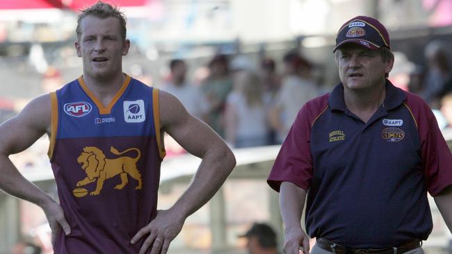 Former Brisbane Lions premiership star Michael Voss and sports psychologist Phil Jauncey walk the boundary during Lions match at the Gabba in 2005. Jauncey spent 15 seasons with the Lions. Picture: David Kapernick 