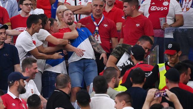 Security staff speak with fans during the Group G match between Serbia and Switzerland. Picture: Getty Images