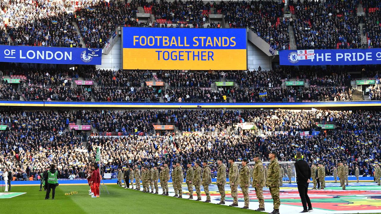 A 'Football Stands Together' message is displayed in Ukrainian colours ahead of the English League Cup final football match between Chelsea and Liverpool. Photo by JUSTIN TALLIS / AFP.