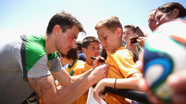 James Troisi meets the fans during a Socceroos training session.