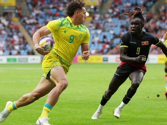 Mark Nawaqanitawase under pressure from Aaron Ofoyrwoth during Australia’s draw with Uganda. Picture: Richard Heathcote/Getty Image