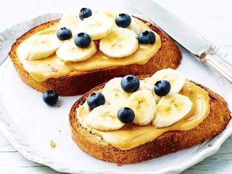 Sourdough toast with nut butter, banana and blueberries.