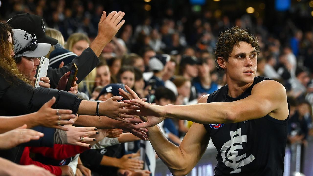 Charlie Curnow celebrates Carlton’s victory with fans.