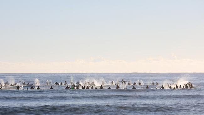 Members of the public took part in a paddle-out at Byron Bay's Main Beach to protest against the planned Netflix reality show Byron Baes on the morning of Tuesday, April 20, 2021. Picture: Liana Boss