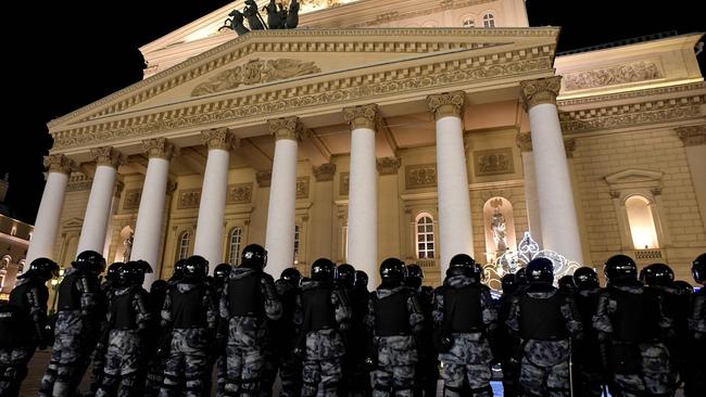 Law enforcement officers stand guard in front of the Bolshoi theatre during a protest against a court decision to jail Alexei Navalny. Picture: AFP.