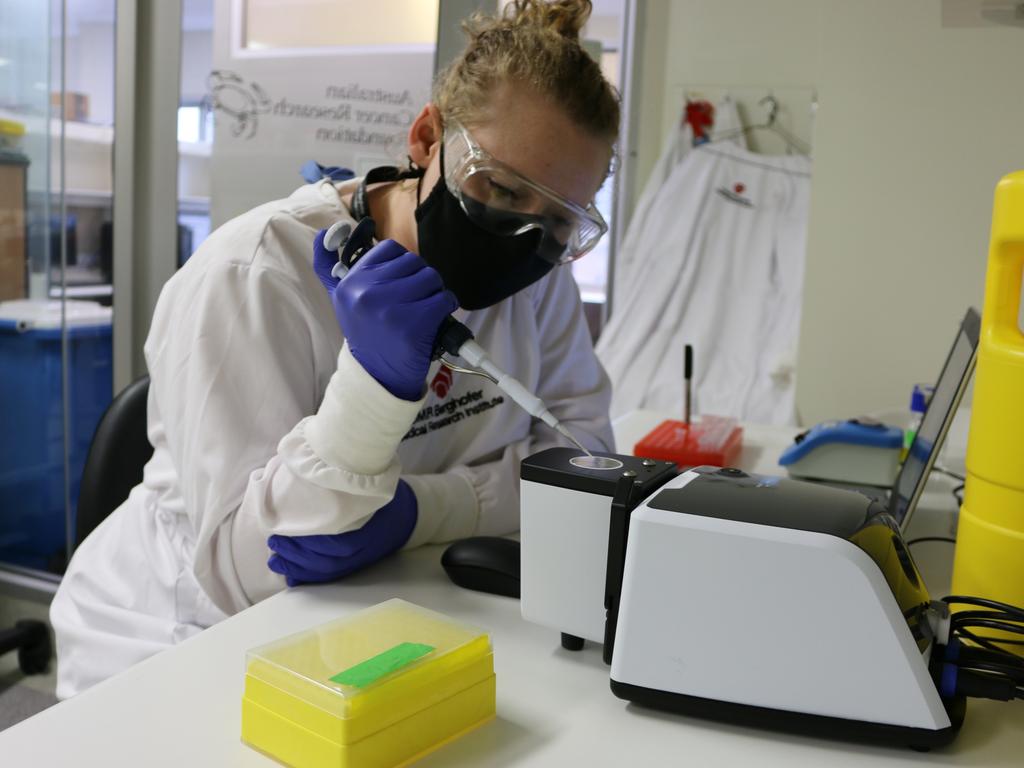 QIMR Berghofer research assistant Harley Robinson using the potential new Covid-19 test