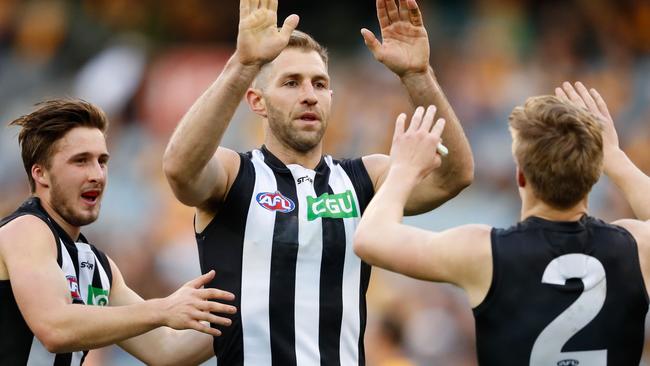 Travis Cloke celebrates a goal with teammates during his final match. Picture: Getty Images