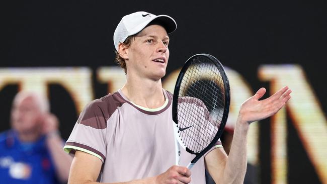 Italy's Jannik Sinner celebrates after victory against Russia's Andrey Rublev during their men's singles quarter-final match on day 10 of the Australian Open tennis tournament in Melbourne on January 24, 2024. (Photo by David GRAY / AFP) / -- IMAGE RESTRICTED TO EDITORIAL USE - STRICTLY NO COMMERCIAL USE --