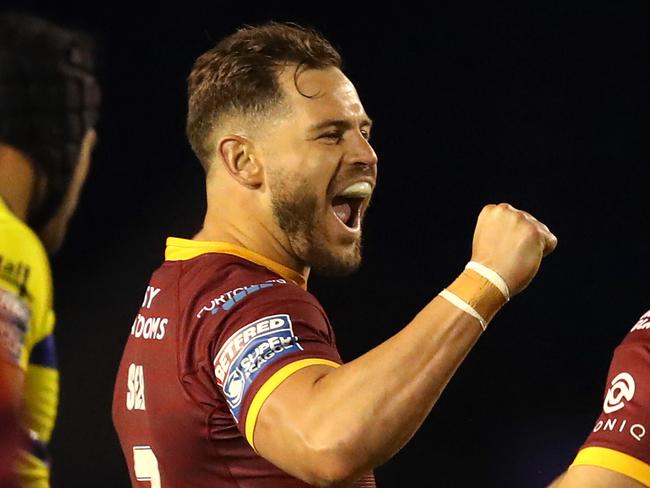 WARRINGTON, ENGLAND - MAY 17: Aidan Sezer (L) of Huddersfield Giants celebrates with team mates Jack Cogger and Kenny Edwards after victory in the Betfred Super League match between Warrington Wolves and Huddersfield Giants at The Halliwell Jones Stadium on May 17, 2021 in Warrington, England. Warrington Wolves will host 4,000 fans in the stadium for the first time in over a year as as coronavirus restrictions are eased in England. (Photo by George Wood/Getty Images)