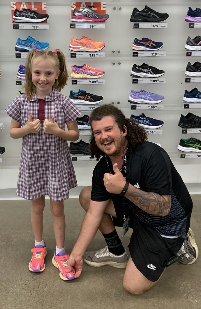 The Hervey Bay Officeworks has helped by printing flyers and Rebel Sports has sponsored her with brand new running shoes. Pictured: Lacey with the general manager at Hervey Bay Rebel Sports.