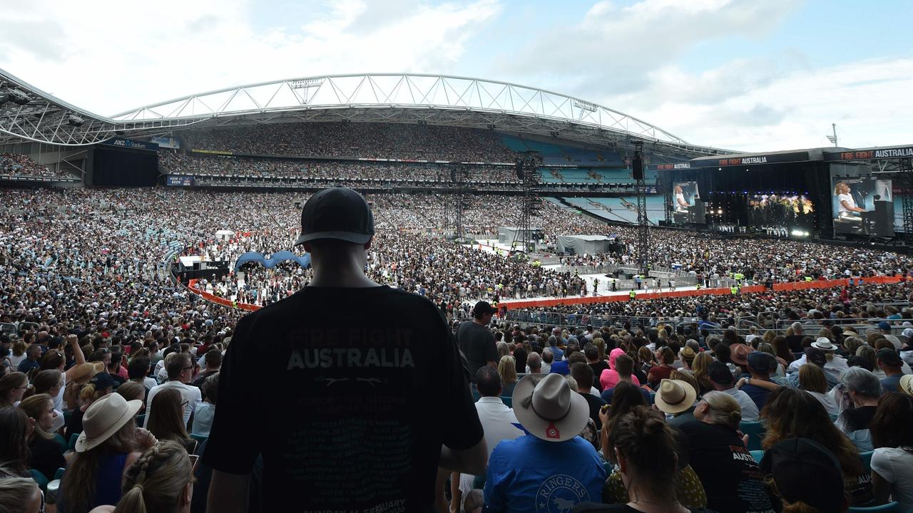 Fans watch US rocker Alice Cooper and his band at the Fire Fight Australia concert. Picture: AFP