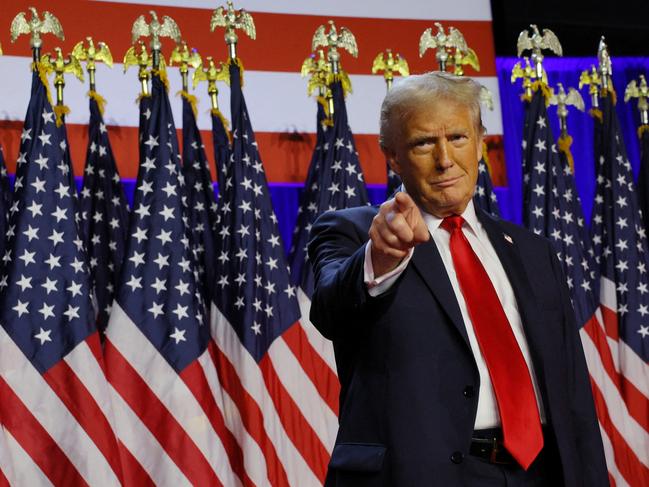 Republican presidential nominee and former U.S. President Donald Trump takes the stage to address supporters at his rally, at the Palm Beach County Convention Center in West Palm Beach, Florida, U.S., November 6, 2024. REUTERS/Brian Snyder     TPX IMAGES OF THE DAY