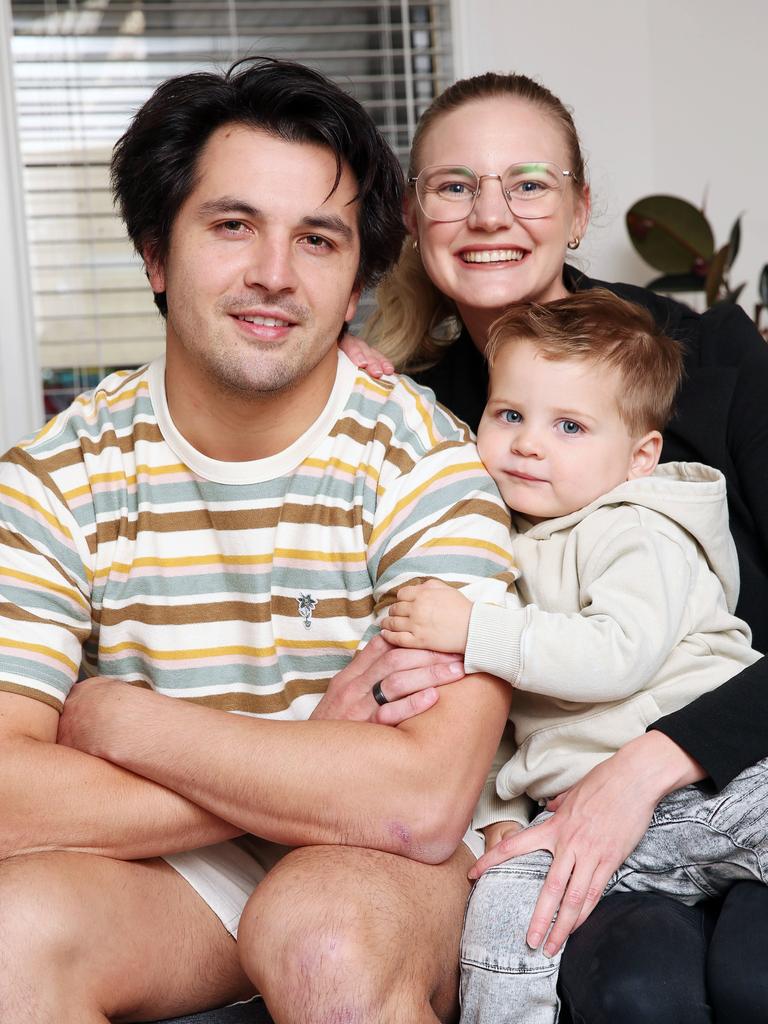 Concussed footballer Jahd Anderson, with his partner Emily Shanley and son Obi, may never play football again. Picture: Alan Barber