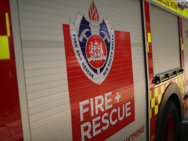 Truck trailer alight as highway blocked off