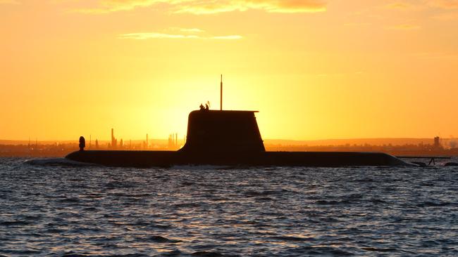 HMAS Collins sails out through the channel to meet HMAS Waller and HMAS Rankin at Gage Roads for a naval exercise.