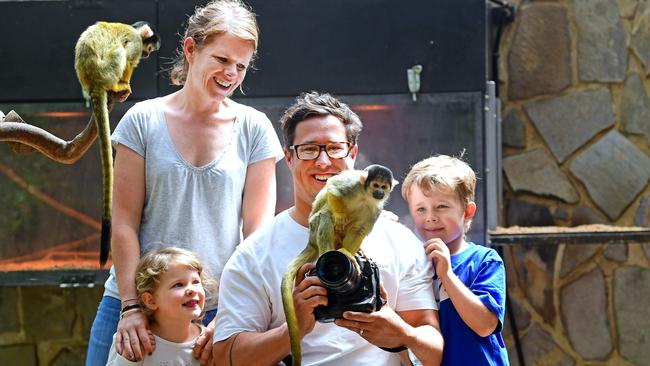 Scott Crowley with his wife Clair and children Oliver, 6, and Maddy, 4 experience being up close with the squirrel monkeys at the Adelaide Zoo. Picture: Mark Brake