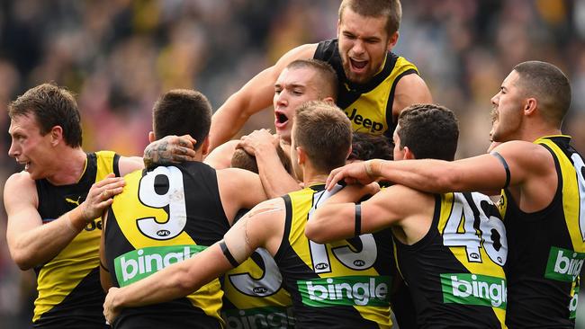 Richmond players celebrate after hitting the front with 21 seconds to go against Fremantle.