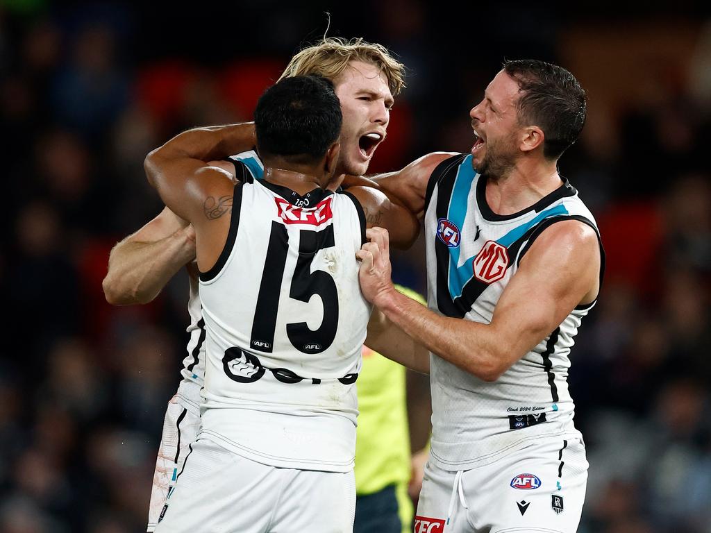 Jason-Horne-Francis, Willie Rioli and Travis Boak enjoy a goal. Picture: Michael Willson/AFL Photos via Getty Images