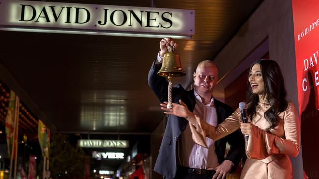 David Thomas and model Jessica Gomes ring the bell to countdown the opening of the Boxing Day sales. Picture: Mark Dadswell