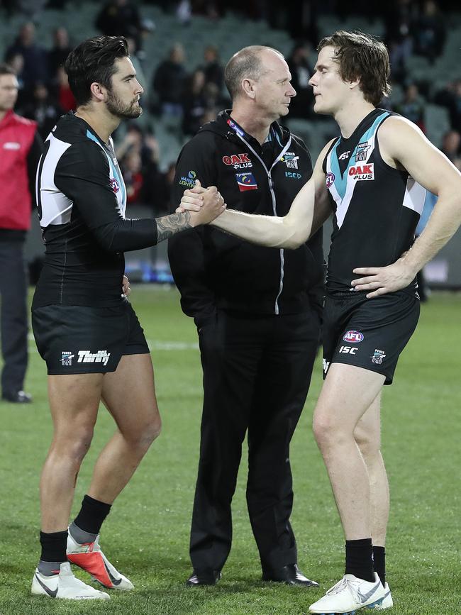 Chad Wingard with Jared Polec and Ken Hinkley after Port’s final-round loss to Essendon. Polec will be at North Melbourne next year, Wingard at Hawthorn. Picture Sarah Reed