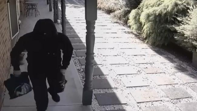 The men stole an undisclosed amount of cash before fleeing in a late-model blue Toyota sedan. Picture: Victoria Police.