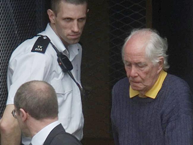 Convicted Great Train robber Ronald Biggs (right) leaves Chiswick Police station on his way to court in May, 2001, after returning to Britain from Brazil where he had been since 1970. Picture: AP