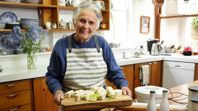 Legendary chef Margaret Fulton is launching a range of kitchenwear at Myer. Pictured with the range at her kitchen in Balmain.