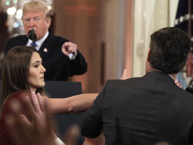 As Donald Trump took aim at CNN's Jim Acosta, a White House aide took the microphone from the journalist. Picture: AP