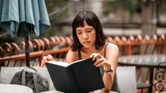 “Some habit swaps include swapping scrolling for intentional reading. For example, replace phone time with books, audiobooks or podcasts." Image: Getty