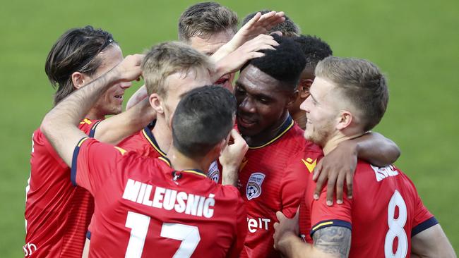 Al Hassan Toure is mobbed by teammates after scoring in the FFA Cup final. Picture: Sarah Reed