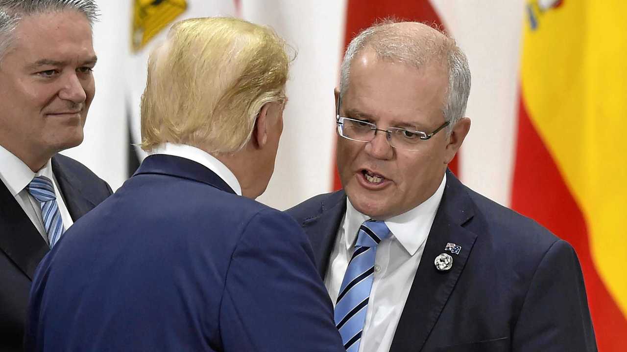 Australia's Prime Minister Scott Morrison, right, chats with U.S. President Donald Trump, centre. Picture: Kazuhiro Nogi