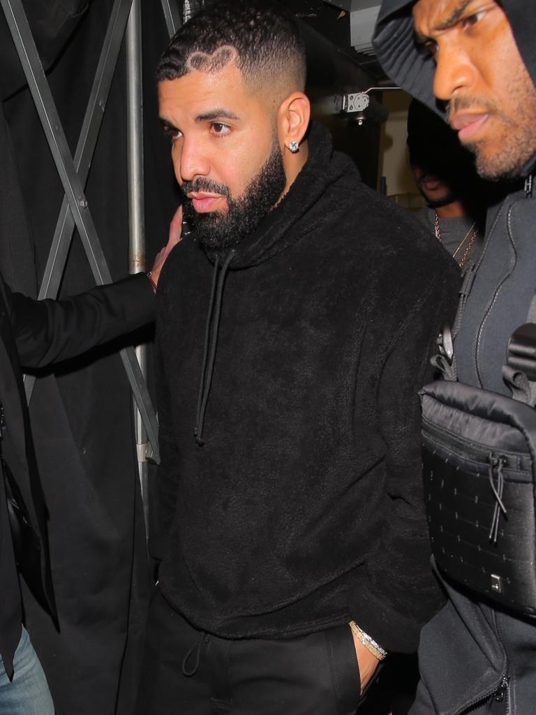 Drake gets a helping hand as he left. Picture: ShotbyNYP / BACKGRID