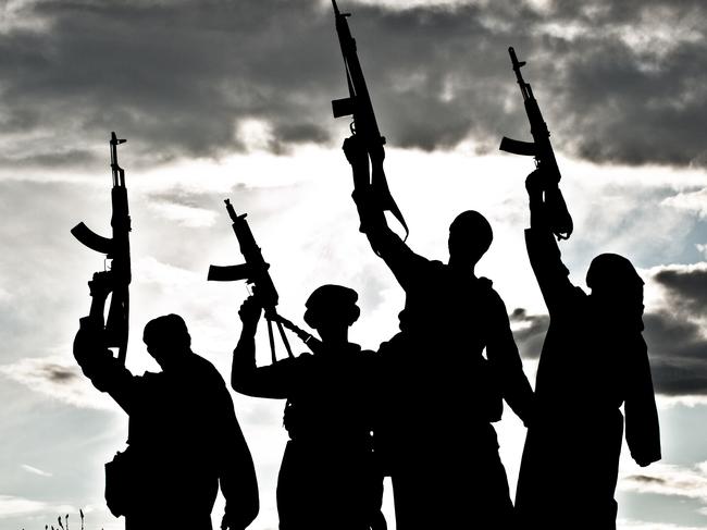 Silhouette of several muslim militants with rifles