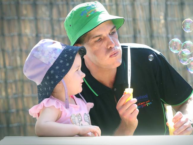 Kindergarten teacher Tim McQuade with Ezekyl Roberts, 2. Picture: Jamie Hanson