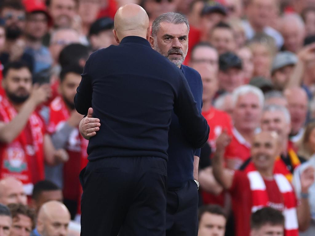 Tottenham manager Ange Postecoglou (right) is embraced by his Liverpool counterpart at Anfield. Picture: Carl Recine/Getty Images